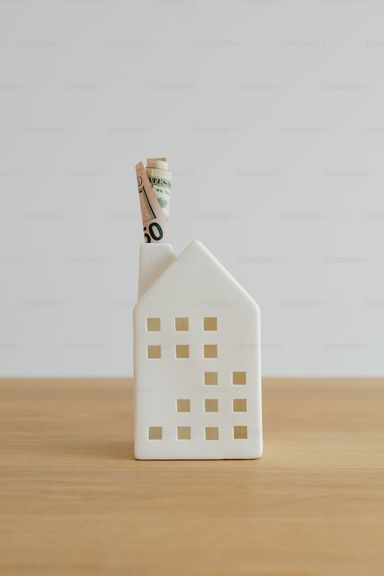 Model house with cash in chimney
